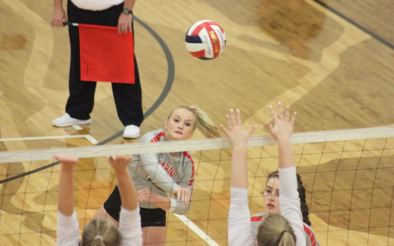 Rabun County’s Ali Ramey, top left, spikes the ball against Dade County during the quarterfinal round of the GHSA Class A/AA-Public state playoffs at Ken Byrd Court in Tiger last Saturday afternoon. (Glendon Poe/The Clayton Tribune)