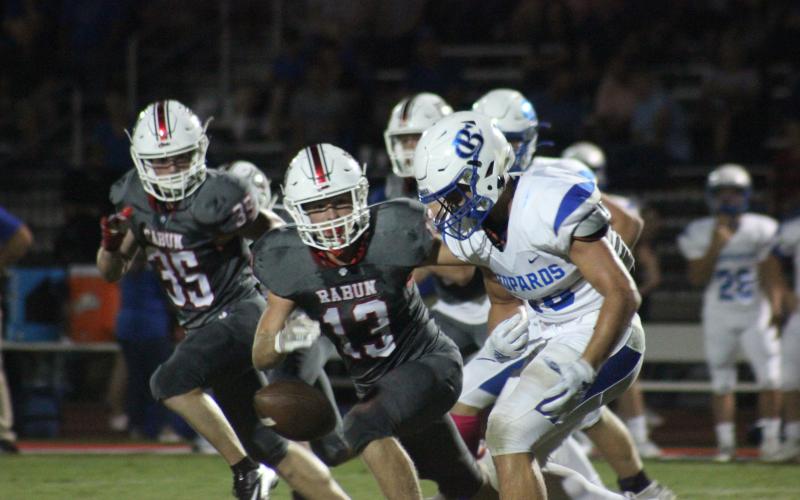 Rabun County linebackers Trent Miller (35) and Brody Jarrard (13) pursue a Banks County fumble at Frank Snyder Memorial Stadium in Tiger on Oct. 4. (Glendon Poe/The Clayton Tribune)