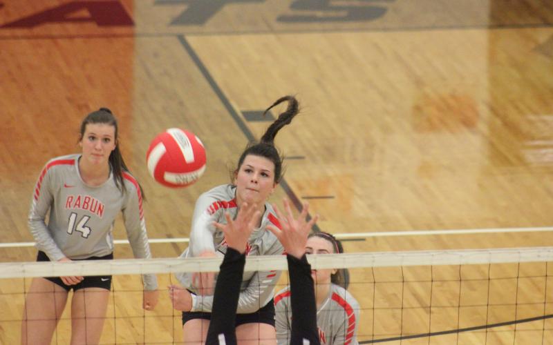 Rabun County’s Destiny Deetz, middle, attacks Union County, while teammates Gracie Deetz, left, and Emma Wofford watch during the GHSA Class A/AA Area 8-Public championship match at Ken Byrd Court in Tiger last Thursday night. (Glendon Poe/The Clayton Tribune)