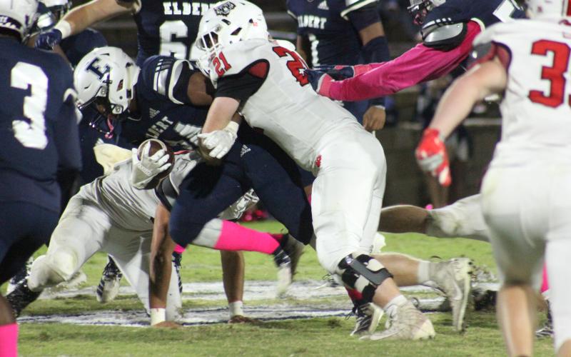 Rabun County linebacker Phillip Roberson (21) tackles an Elbert County runner in Elberton last Friday night. (Glendon Poe/The Clayton Tribune)