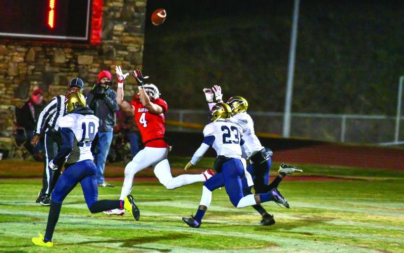 Scott Poss/The Clayton Tribune. Braxton Hicks goes up for a Gunner Stockton pass against B.E.S.T. Academy Friday night.