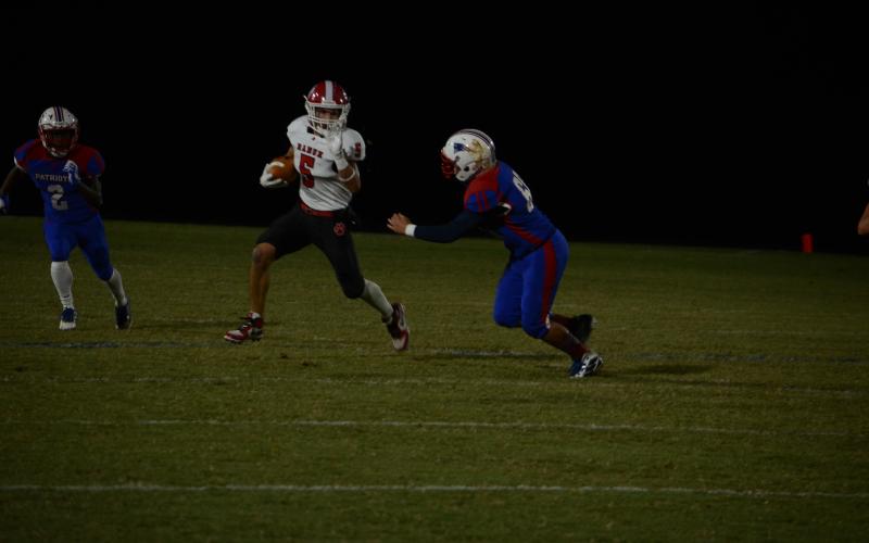 Wayne Knuckles/The Clayton Tribune. Sophomore wide receiver Hogan Woodward picks up yardage against Oglethorpe on a punt return last Friday night.