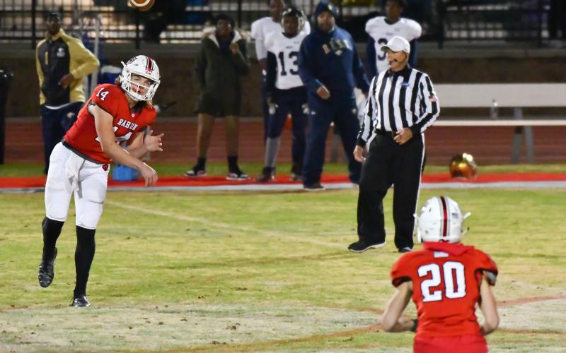Gunner Stockton completes a pass to Sutton Jones against B.E.S.T. Academy Friday night.