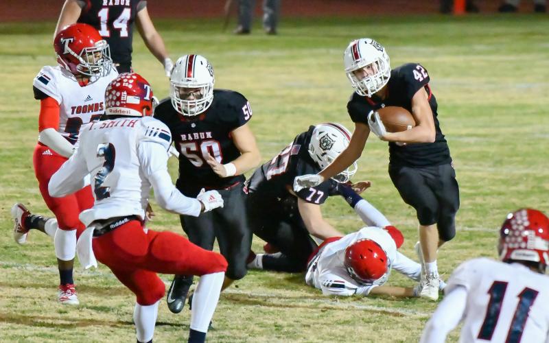 Scott Poss/The Clayton Tribune. Clayton Dixon leads the blocking as Cory Keller picks up yardage against Toombs County Friday night.