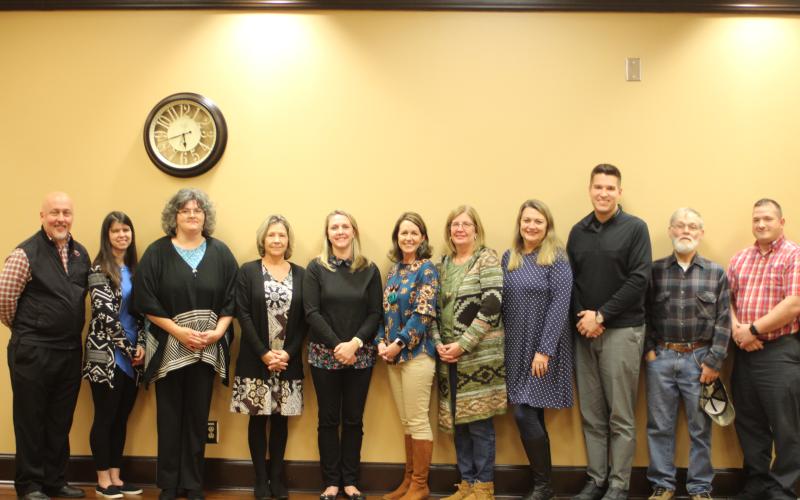 Megan Broome/The Clayton Tribune. Rabun County Schools recognized December Employees of the Month at their recent council meeting. Jay Fowler, RCPS Principal, from left, Jennifer Green, RCPS Employee of the Month, Laura Welborn, RCPS, Kelly Nixon, BOE Office, Jessica Cantrell, RCES, Stefanie Taylor, RCMS, Vicki Tyler, RCMS Principal, April Marshall, RCHS, Justin Spillers, RCHS principal, Jake Davis, Transportation Employee of the Month and Marty Dixon, Transportation Director.