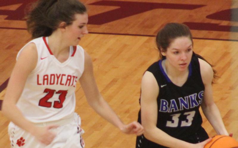 Andy Diffenderfer/The Clayton Tribune Rabun County's Gracie Deetz shadows Hailey Seahorn of Banks County in a Region 8-AA semifinal.