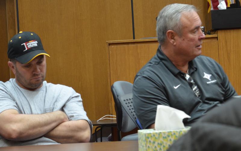 Wayne Knuckles/The Clayton Tribune County commissioners Will Nichols, left, and Kent Woerner at Friday’s emergency meeting of the Rabun County Board of Commissioners.