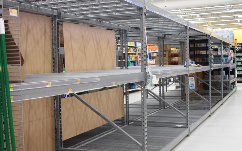 Megan Broome/The Clayton Tribune Customers are seeing empty shelves as they visit various stores around Rabun County due to an influx of people buying products in bulk amid the COVID-19 pandemic. Store personnel continue to work to constantly restock the shelves as quickly as possible, and supply trucks are arriving daily. Shown is the vacant toilet paper aisle at Walmart on Monday.