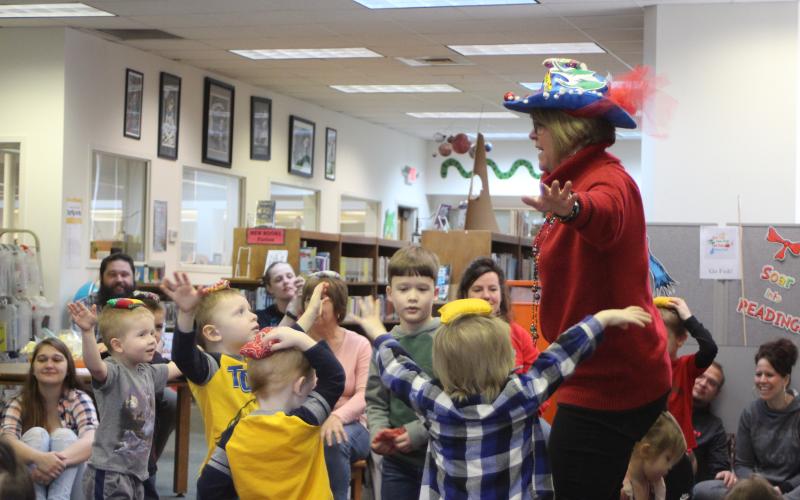Megan Broome/The Clayton Tribune. Children sing and do the "Beanie Bag Dance" at the Rabun County Library on Wednesday, March 4 as part of activities celebrating Read Across America and the birthday of Dr. Seuss, which was celebrated March 2.