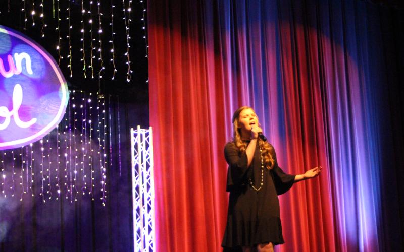 Megan Broome/The Clayton Tribune. Hannah Thompson sings the song “Stay” for her judges’ choice solo performance.