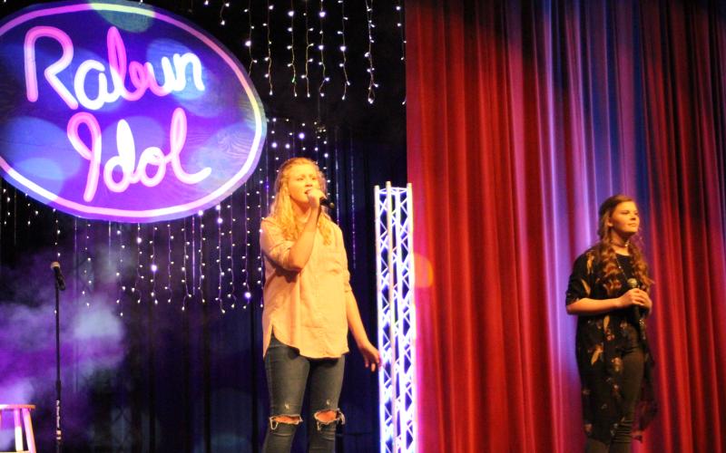 Megan Broome/The Clayton Tribune. Hailey Smith, left, and Hannah Thompson sing a duet of the song “Reckless Love.”