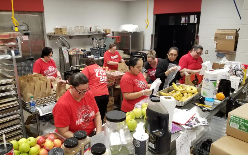 Photo courtesy Kristin Schupp Rabun County Primary, Elementary, and High School cafeteria staff come together to prepare 4,000 meals that fed 400 children for 5 days Monday. Director of School Nutrition Kristin Schupp said the Board of Education will continue this service as long as schools are closed for any child in our community.