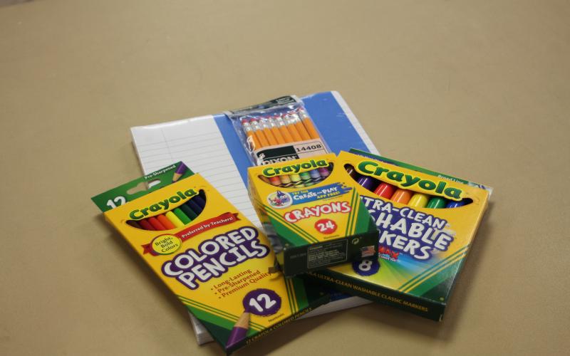 Megan Broome/The Clayton Tribune. One bag of art supplies will be provided to each family at meal distribution on Monday, April 6. Above are the art supplies added to each bag.