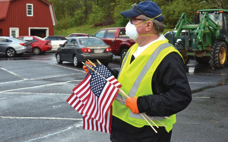 Wayne Knuckles/The Clayton Tribune. Rev. Don Barber, pastor of Rabun Gap Presbyterian Church, oversees preparations for Saturday's food distribution.