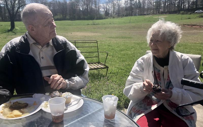 Photo courtesy Traces of Tiger. Ed and Diane Elliott sit outside and eat while spending time talking with each other at Traces of Tiger recently.