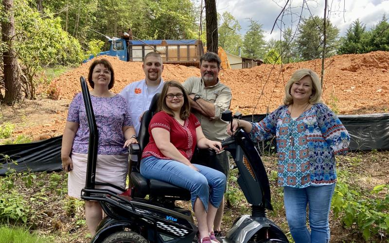 Submitted photo. Habitat requires "sweat equity" of each of their homeowners. Allison and Daniel's family have all joined in to help. From left to right: Kay Burrell, Daniel's mother, Daniel NIcholson, Jerry McFalls, Allison's father, Allison, and Allison's mother, Vicky McFalls.