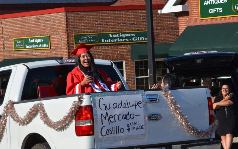 Wayne Knuckles/The Clayton Tribune. Members of the Class of 2020 were honored with a parade through Clayton Tuesday. Guadalupe Mercado-Castillo is all smiles as the crowd applauds.