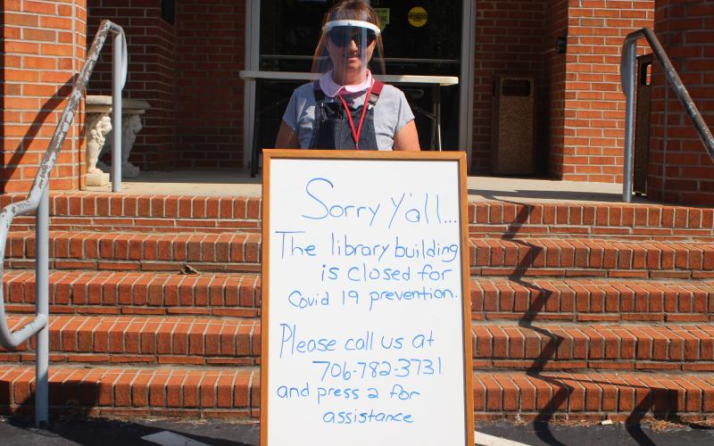 Megan Broome/The Clayton Tribune. Library Manager and "Chief Nerd" Caroline Frick