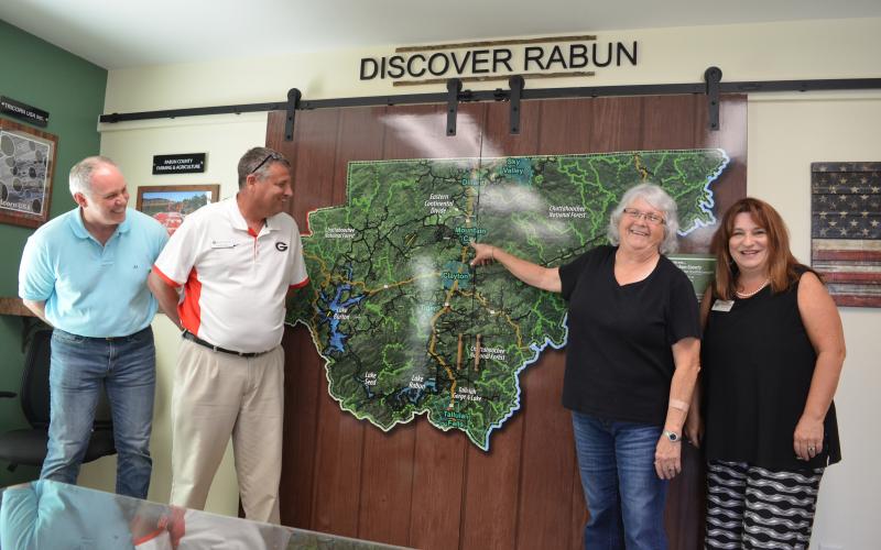 Wayne Knuckles/The Clayton Tribune. Rabun Chamber of Commerce President Juanita Shope has been hired by the county as a Business Development and Marketing Specialist. Meeting to discuss the appointment at the new Welcome Center on Highway 441 are, from left, Rick Story, executive director of the Development Authority of Rabun County, Claude Dillard, Development Authority board chairman and Dillard City Council member, Shope and Irene Bynum Faith, chairman of the Rabun County Chamber of Commerce.