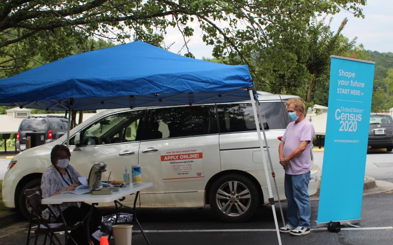 Megan Broome/The Clayton Tribune. Terrell Wilson, right, gets assistance about the 2020 Census from Denica McCurdy, Census Response Representative (CRR) and Mobile Questionnaire Assistant (MQA) for the 2020 Census. A tent was set up at the Rabun County Public Library Monday and Tuesday to help Rabun residents learn more about the 2020 Census and assist with any questions they had.