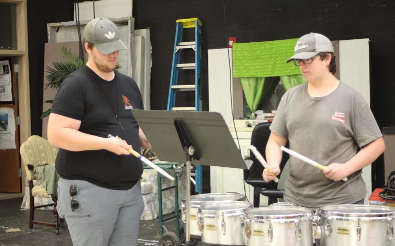 Percussion Instructor Isaac Oakes helps Sean King during percussion sectionals at band camp at Rabun County High School last week.