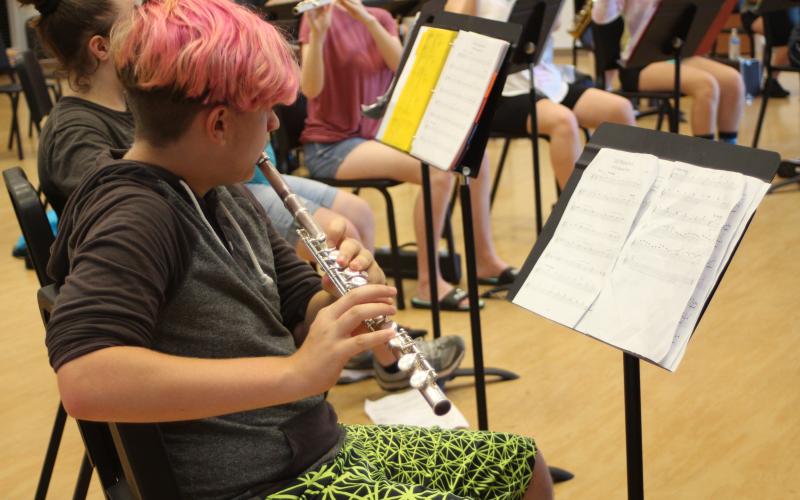 Bradlee Thomason plays an instrument during woodwind sectionals practice in the Rabun County High School band room at band camp.