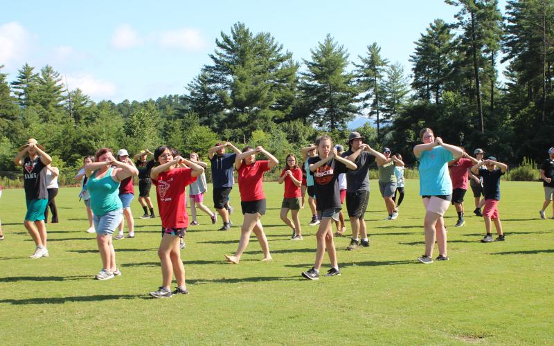 Asia Tran-Cao, left, Katie Shields and Grace Dyer work on marching fundamentals.
