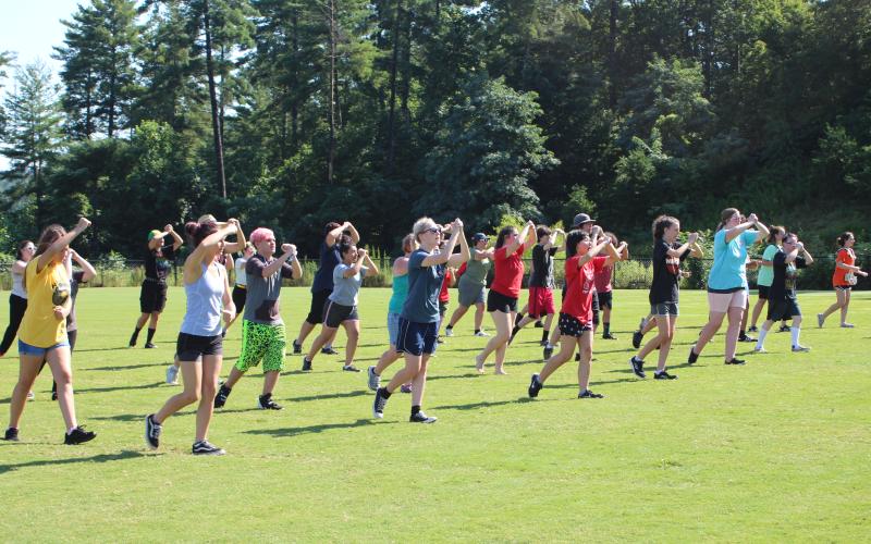 Kristin Daniel, left, Tiffani Dobson, McKenzie Hamilton, Asia Tran-Cao, Katie Shields, Grace Dyer and Janie Henslee work on marching fundamentals.