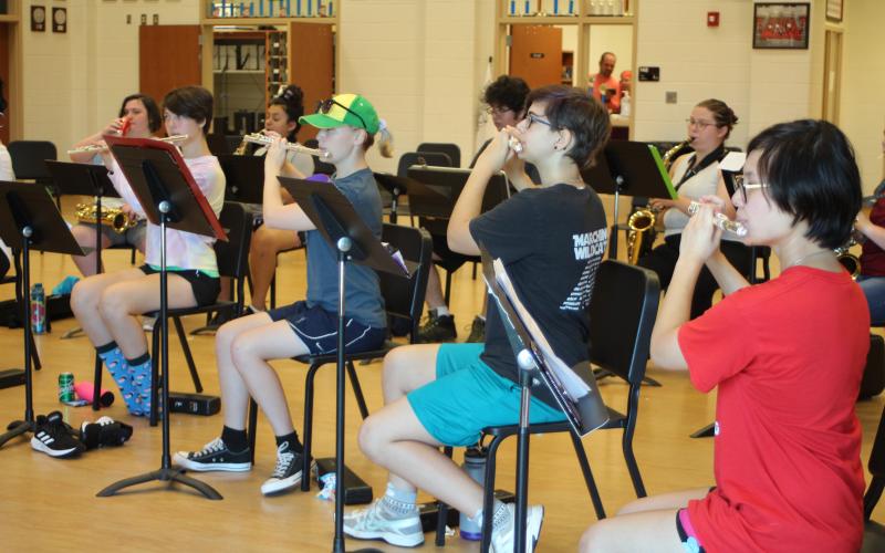 Audrey Shoemberg, left, McKenzie Hamilton, Elena Ellis, Asia Tran-Cao practice during woodwind sectionals in the Rabun County High School band room at band camp.