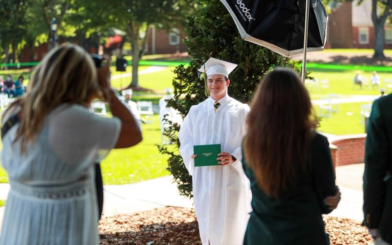 Rabun Gap-Nacoochee School senior Quillen Martin ‘20 of Clayton, GA poses for some socially-distanced pictures after graduation.