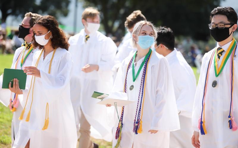 Members of the Rabun Gap-Nacoochee School Class of 2020 celebrate during graduation on Sunday, August 9. Pictured from left are D’Amara Serjan ‘20 of Franklin, NC, Victoria Cochran ‘20 of Clarkesville, GA, and Simon Park of Charlotte, NC. 
