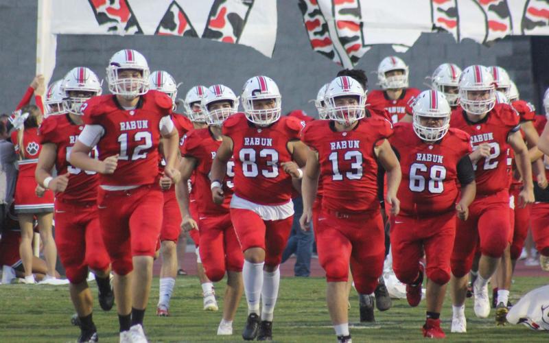 Andy Diffenderfer/The Clayton Tribune. The Wildcats charge onto the field for last Friday’s game with Jefferson at Frank Snyder Memorial Stadium
