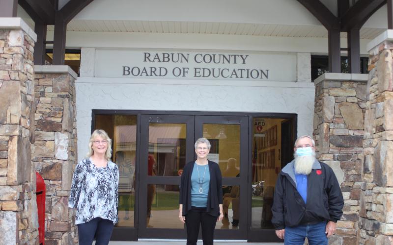 Megan Broome/The Clayton Tribune. Retirees of Rabun County Schools, Judy Burch, 14 years, Becky Cross, 25 years, and Pop Wilburn, 13 years, were recognized at the September Board of Education meeting.
