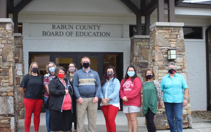 Megan Broome/The Clayton Tribune. Kelly McKay, Robin Hurwitz, Candice Mathis, Kelsey Watts, Preston Pitts, Ashley Stephens, Hannah Dean, Starla Shiver and Diane Cochran were recognized as August Employees of the Month at last Thursday’s Rabun County Board of Education meeting. Not pictured: Joan Hollifield.