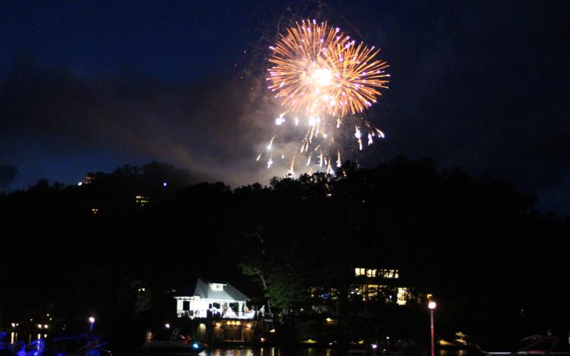 Megan Broome/The Clayton Tribune. Fireworks boomed over Lake Burton Saturday night for the conclusion of a months-long 100th birthday celebration of the creation of Lake Burton.
