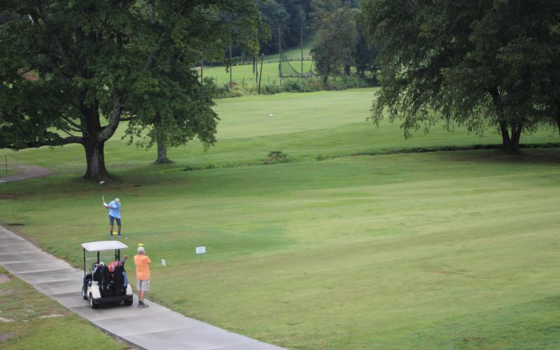 Megan Broome/The Clayton Tribune. Dr. Guy Gober, who organized the 16th annual prostate cancer awareness golf tournament, and partner Perry Thompson join as a team and play a round of golf to participate.