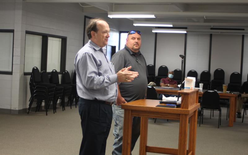 Megan Broome/The Clayton Tribune. Eric Neese, of the engineering company Freese and Nichols, Inc., and Public Works Director Jason Walroup address Clayton council members Tuesday and give an update on the GDOT project to widen Highway 441.