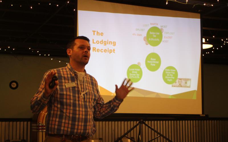 Megan Broome/The Clayton Tribune. Rabun officials received an overview of hotel-motel tax issues from Tyler Reinagel, director of planning and research for the Georgia Dept. of Community Affairs last week.