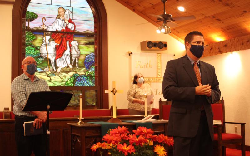 Megan Broome/The Clayton Tribune. Church members attend a service in the Tom McClure Memorial Chapel in Sky Valley Sunday and worship with music and prayer. The congregation heard a sermon from guest Minister Chris Stratton about living a Christian life that uplifts one another.