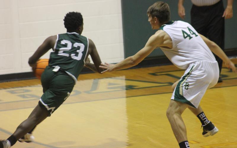 Andy Diffenderfer/The Clayton Tribune Devonte Allen of Tallulah Falls tries to drive on Rabun Gap’s Zsombor Vertes.