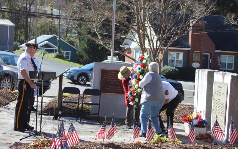 Megan Broome/The Clayton Tribune. The laying of the wreath to honor those men and women who served their country and paid the ultimate sacrifice is a tradition at the Veterans Day event every year.