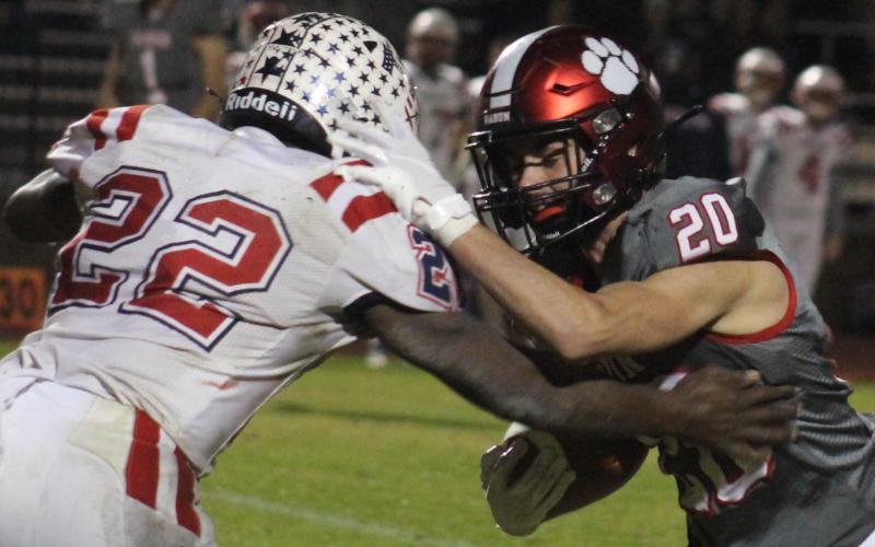 Andy Diffenderfer/The Clayton Tribune Rabun County receiver Sutton Jones battles for more yardage against Haralson County’s Marc Harris.