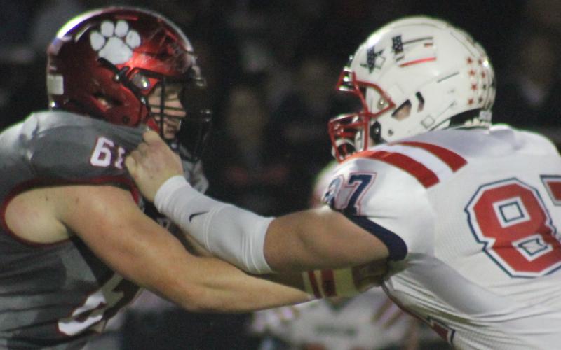 Andy Diffenderfer/The Clayton Tribune Wildcat lineman Will McCraw tangles with Haralson County’s Riley Bell in last Saturday’s Class AA first-round playoff at Frank Snyder Memorial Stadium.