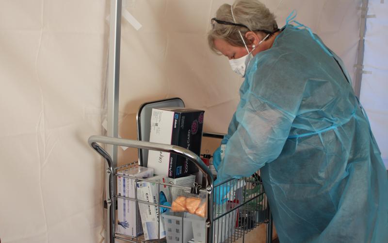Megan Broome/The Clayton Tribune. Nurse Dulene Jones administers COVID tests at the drive-thru clinic at the Rabun County Health Department on Tuesday.