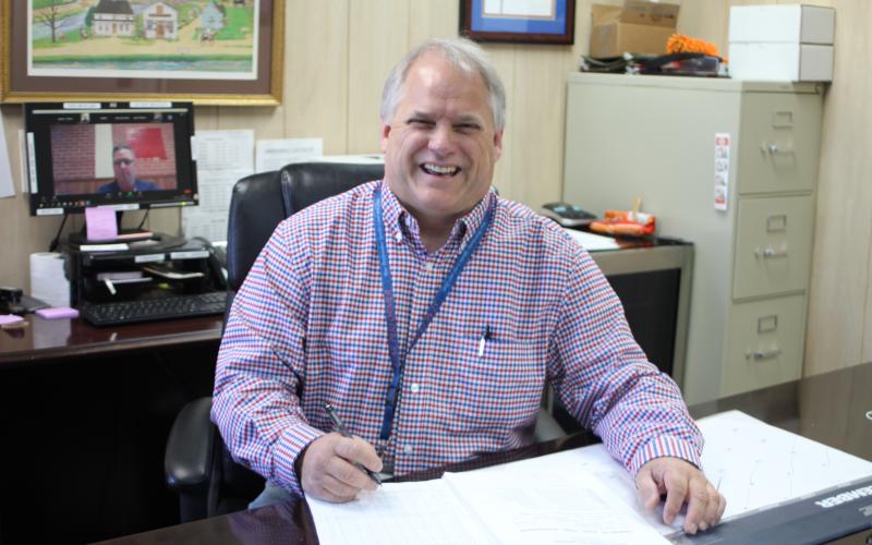 Megan Broome/The Clayton Tribune. Byron Youngblood is the supervisor of customer services at the Clayton Post Office and retires at the end of the year after 34 years of service to the United States Postal Service.