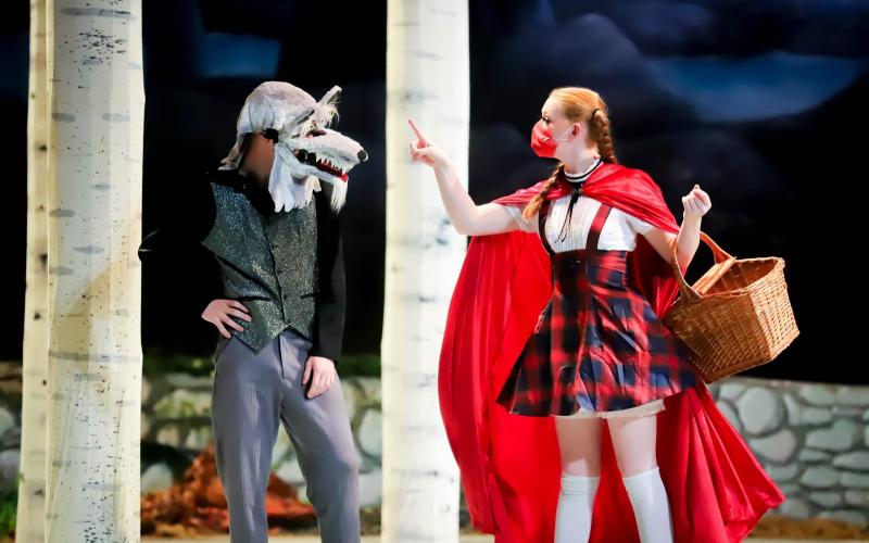 Photo courtesy Rabun Gap-Nacoochee School. Peyton Coppage ‘21 of Sky Valley, GA as Little Red Riding Hood, left, confronts The Wolf, played by Dustin Anderson ‘23 of Hiawassee, GA during Rabun Gap-Nacoochee School’s production of “Into the Woods”. 