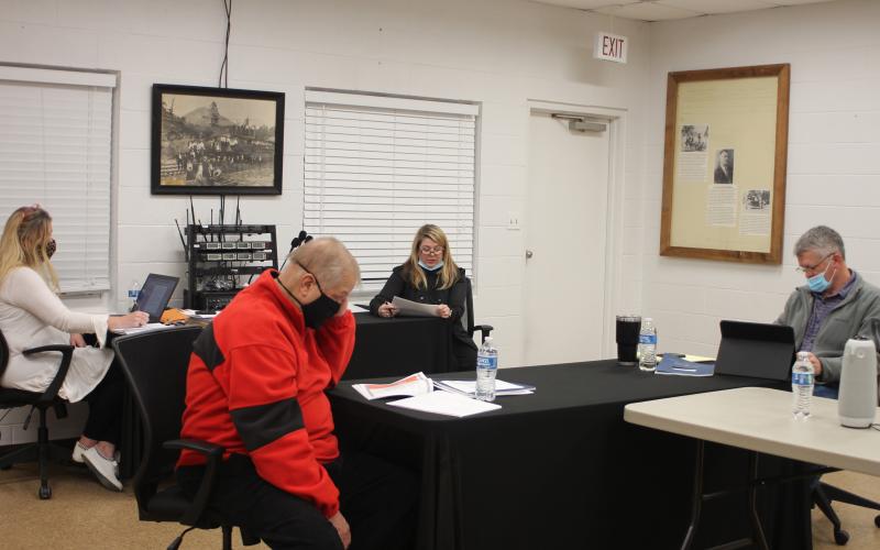 Megan Broome/The Clayton Tribune. Tallulah Falls City Clerk Linda Lapeyrouse, left, and Council Members Joey Fountain and Craig Weatherly receive the city’s fiscal year 2020 audit in a presentation from Joely Mixon of Mixon, Mixon, Brown and Tench CPAs at the Tallulah Falls town council meeting last Thursday.