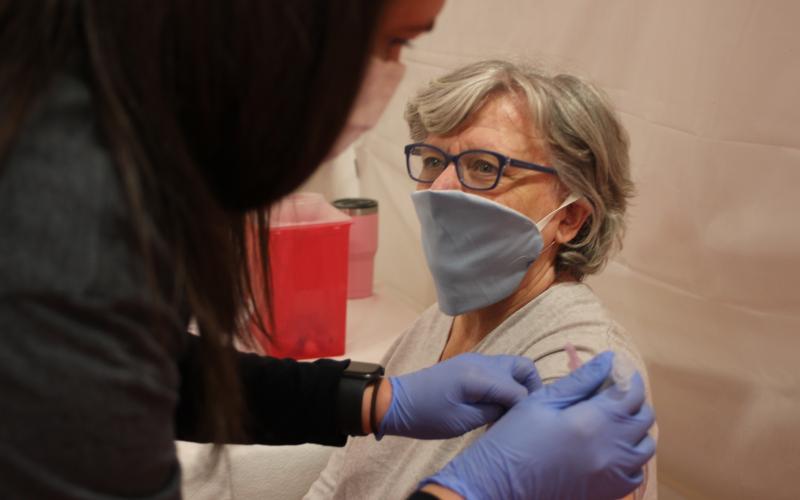 Megan Broome/The Clayton Tribune. Nurse Practitioner Natalie Hunter gives Rosa Gray a COVID-19 vaccine at the vaccination clinic held at the Rabun County Recreation Department on Tuesday.