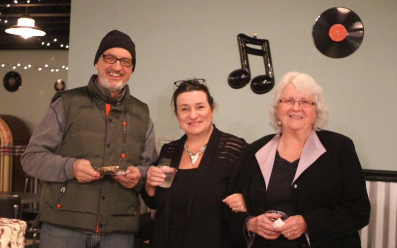 Megan Broome/The Clayton Tribune. Dr. Guy Gober, left, Irene Bynum Faith and Juanita Shope attend a reception honoring Shope last Thursday at The Diner below the Rabun County Civic Center. Shope recently stepped down as president and community liaison of the Rabun County Chamber of Commerce.