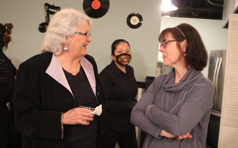 Megan Broome/The Clayton Tribune. Juanita Shope, left, and Inger Smith converse at a reception last Thursday to honor Shope’s service to Rabun County as she steps down as president and community liaison of the Rabun County Chamber of Commerce. The event was held at The Diner below the Rabun County Civic Center.